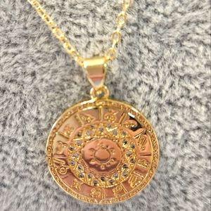 Gold filled zodiac seal with the sun in the middle 18" chain